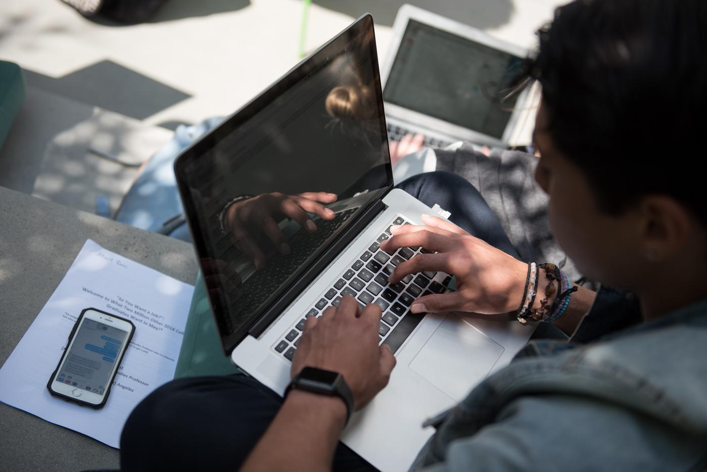 A student working on their laptop