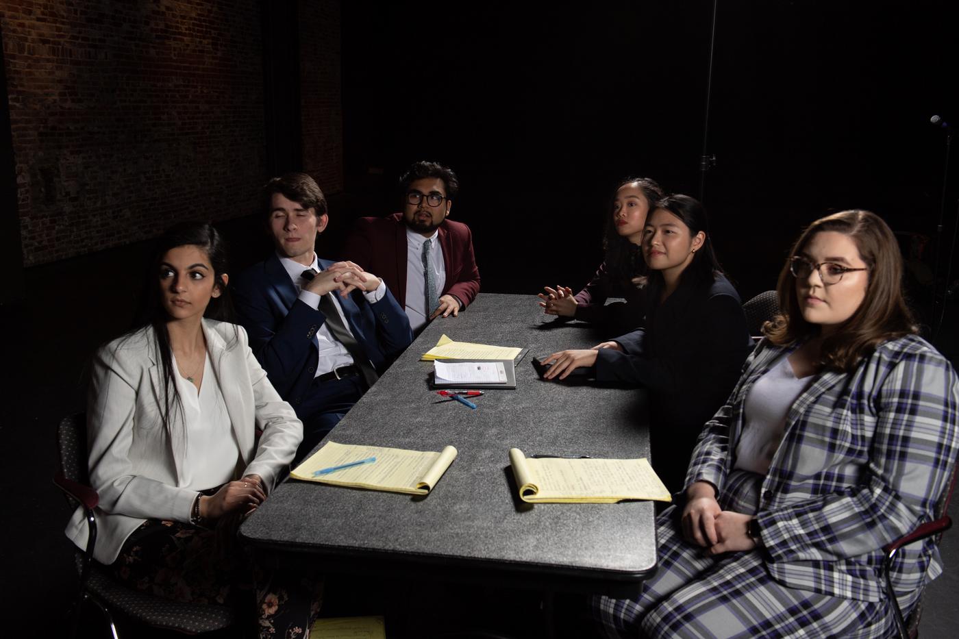Panel of people sitting at the table