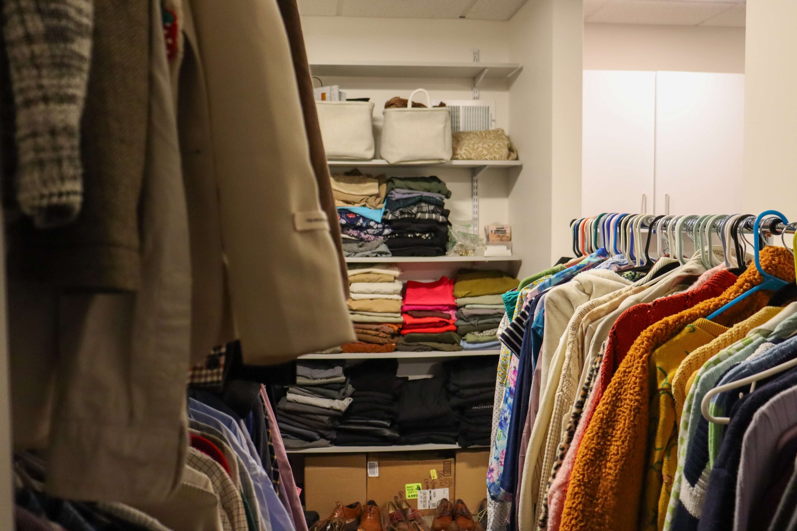 The clothes in the Career Closet room on clothing racks