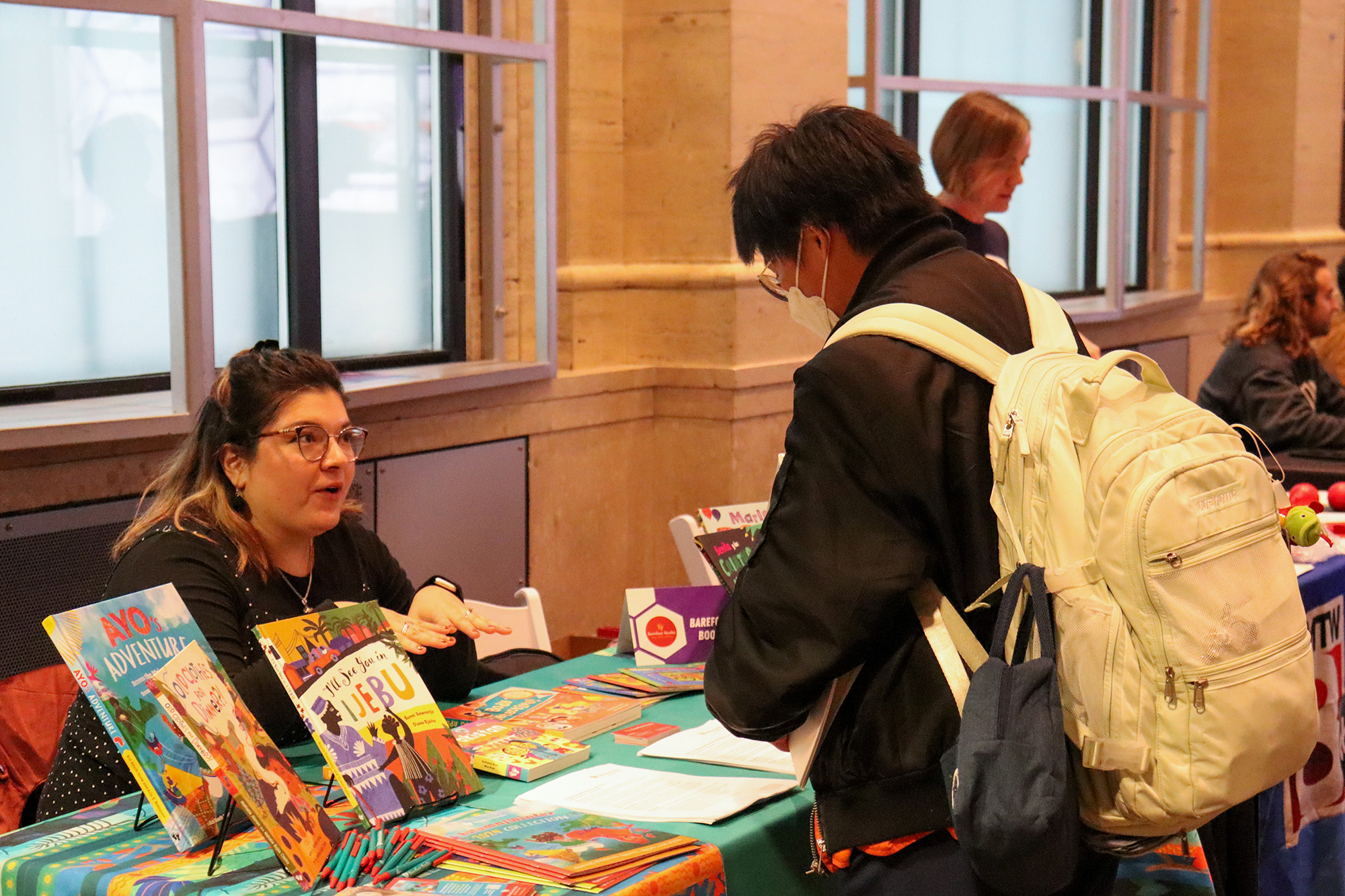 Emerson Student engaging with a Barefoot Books representative about career opportunities at the publishing house during the Career Fair
