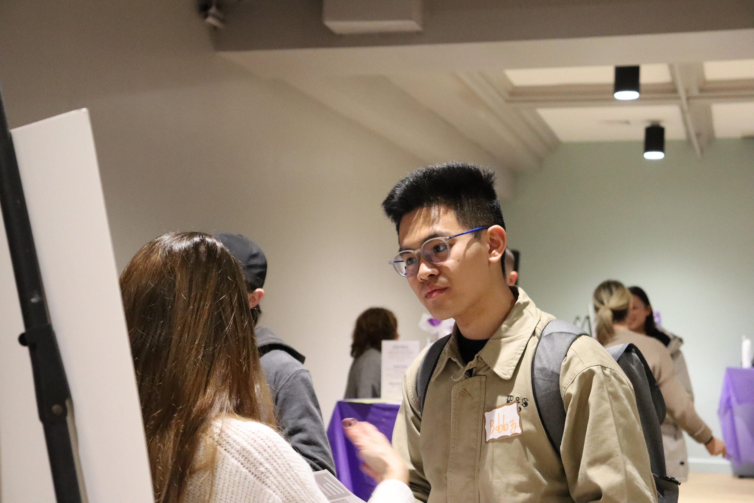 Emerson student listening to an employer at Internship Launch